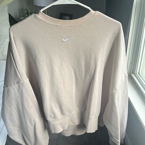 Cream colored Nike crew neck sweatshirt